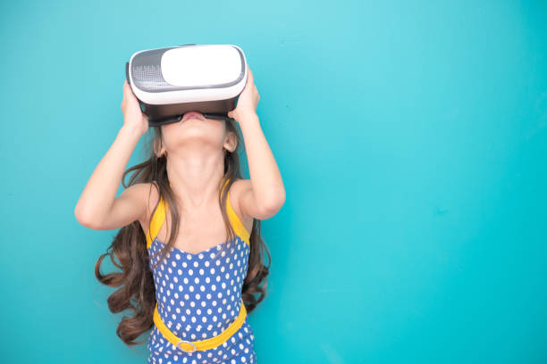 istock Young girl wearing VR headset. 971370660
