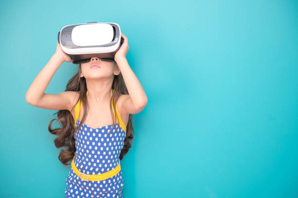 istock Young girl wearing VR headset. 971370666