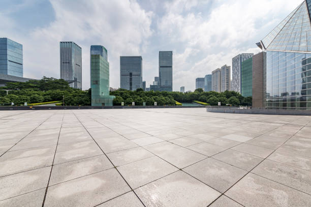 istock Panoramic skyline and modern business office buildings with empty road,empty concrete square floor 971373796