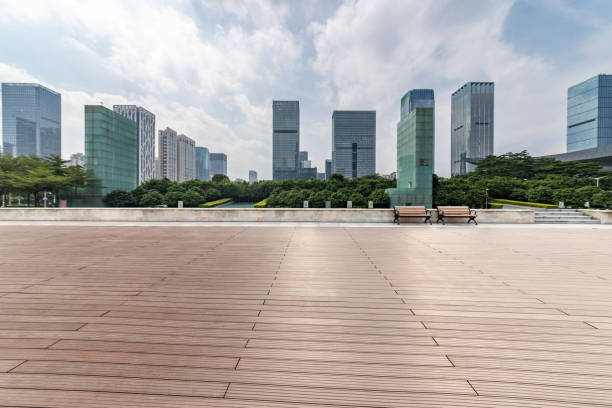 istock Panoramic skyline and modern business office buildings with empty road,empty concrete square floor 971373900