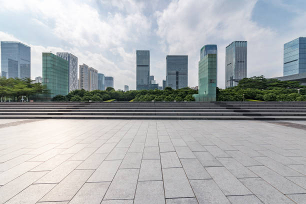 istock Panoramic skyline and modern business office buildings with empty road,empty concrete square floor 971373958