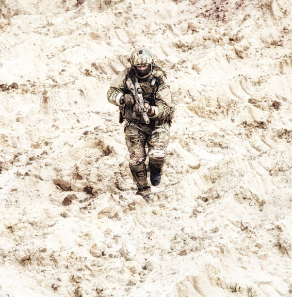istock Army ranger running during offensive in desert 971374538