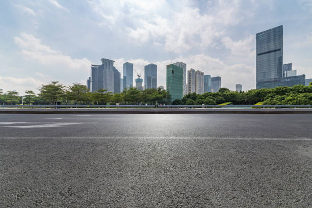 istock Panoramic skyline and modern business office buildings with empty road,empty concrete square floor 971377066