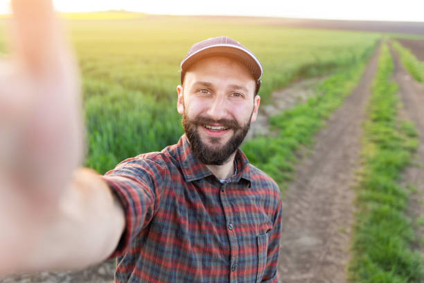 Farmer making a video about  in field