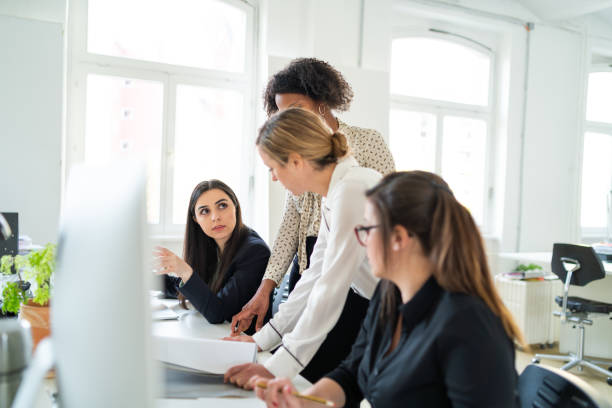 istock Female business team collaborating on project 971381048