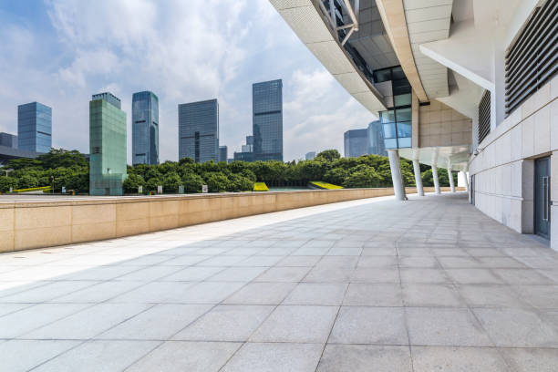 istock Panoramic skyline and modern business office buildings with empty road,empty concrete square floor 971381312
