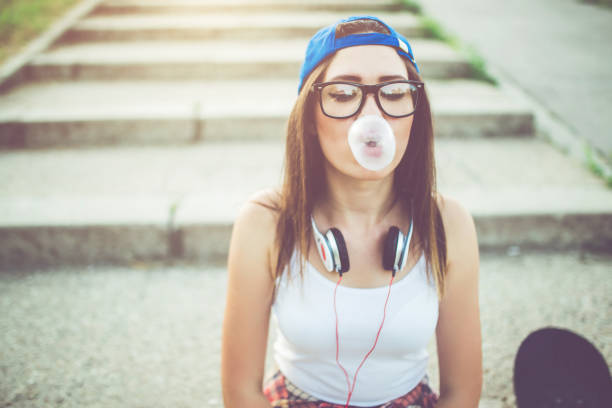 istock Hipster girl chewing bubblegum 971385222