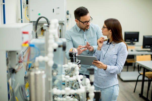 istock Young couple of students at robotics lab 971388088