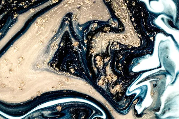 Photo of Natural Luxury. Marbling pattern. Style incorporates the swirls of marble or the ripples of agate. Ancient oriental drawing technique.