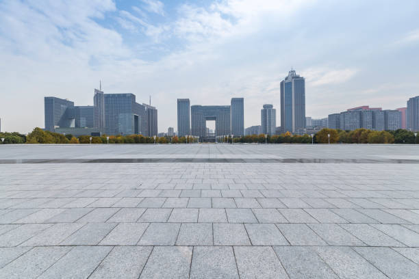 istock Panoramic skyline and modern business office buildings with empty road,empty concrete square floor 971391672