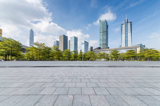istock Panoramic skyline and modern business office buildings with empty road,empty concrete square floor 971392438