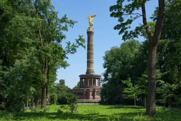 a view of the popular Victory Column in Berlin, Germany, seen from the Tiergarten park