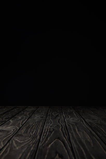 istock grey grungy wooden table on black 971396456