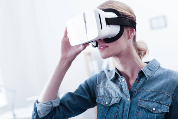 istock Serious smart woman holding her 3d glasses 971396972