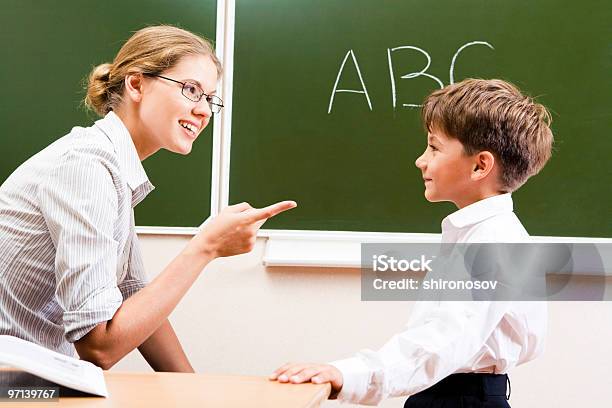 Explaining Rules Stock Photo - Download Image Now - Adult, Alphabet, Boys