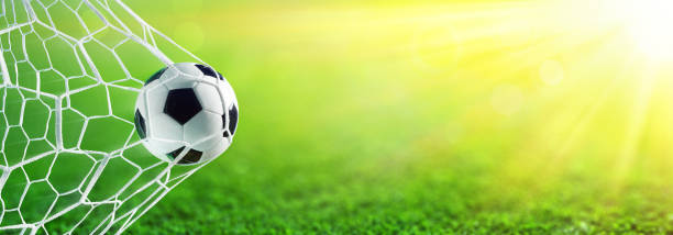 Soccer Ball In Goal With Sunlight