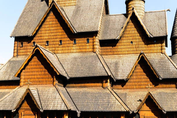 Abstract of Heddal stave church roof The 13th century Heddal stave church on a sunny day. Details of the roofs and the wooden rooftiles. This is the biggest stave church in Norway. heddal stock pictures, royalty-free photos & images