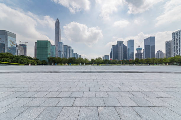 istock Panoramic skyline and modern business office buildings with empty road,empty concrete square floor 971403694