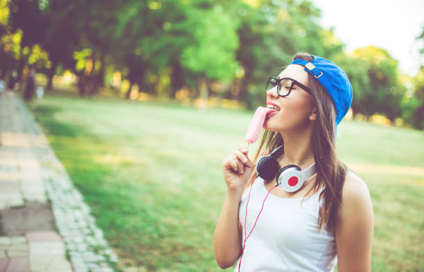 istock Girl licking ice cream 971404340