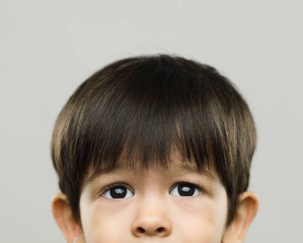 istock Halved portrait of real scared kid 971409952