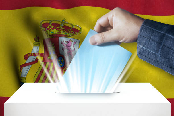 istock Spain - Voting On Ballot Box With National Flag Background 971420240