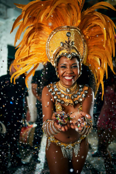 Just have fun with it Cropped portrait of a beautiful samba dancer performing in a carnival with her band headdress stock pictures, royalty-free photos & images