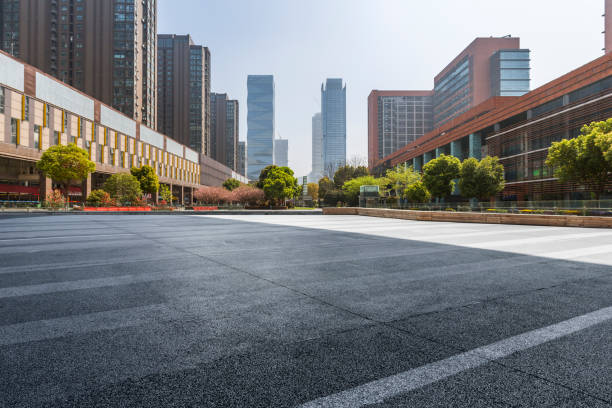 Panoramic skyline and modern business office buildings with empty road,empty concrete square floor