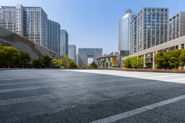istock Panoramic skyline and modern business office buildings with empty road,empty concrete square floor 971423872