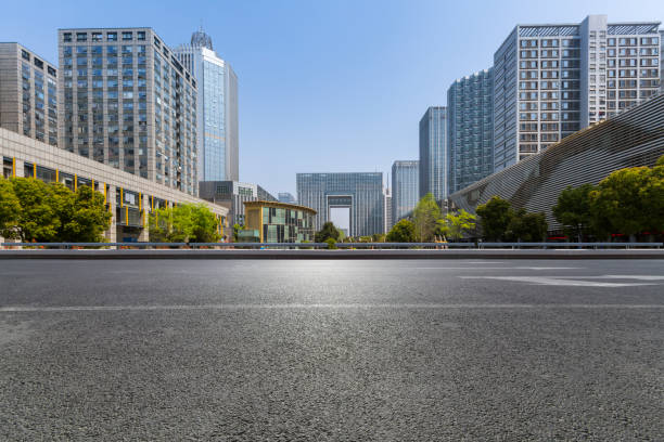 istock Panoramic skyline and modern business office buildings with empty road,empty concrete square floor 971423904