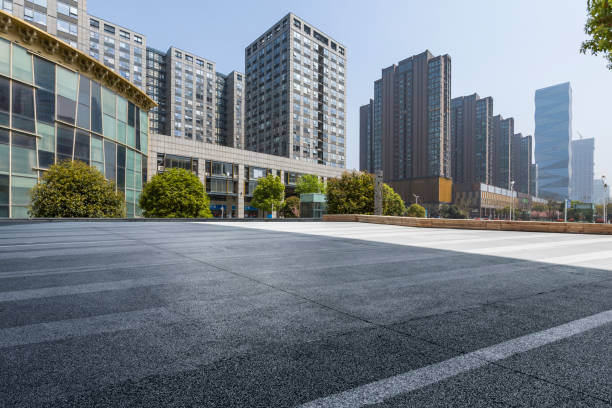 istock Panoramic skyline and modern business office buildings with empty road,empty concrete square floor 971427002
