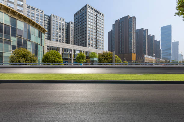 istock Panoramic skyline and modern business office buildings with empty road,empty concrete square floor 971427008