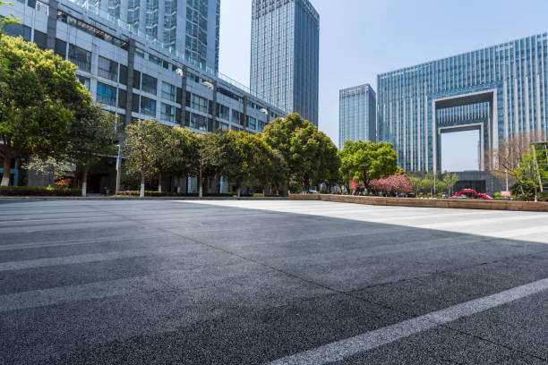istock Panoramic skyline and modern business office buildings with empty road,empty concrete square floor 971427536