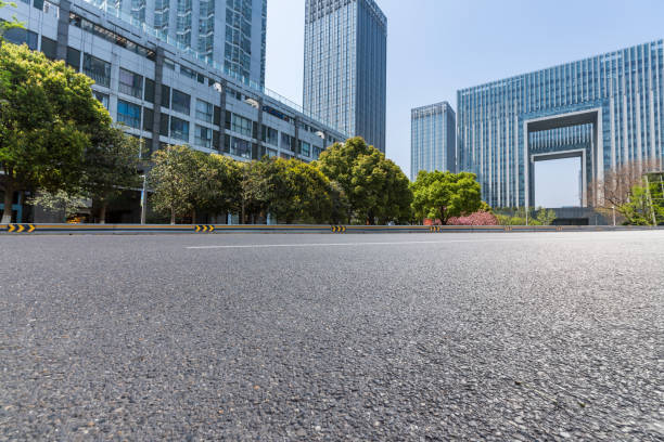 istock Panoramic skyline and modern business office buildings with empty road,empty concrete square floor 971429608