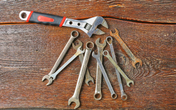istock Workshop bench. Variety of hand tools on a wooden table, top view, copy space 971429786
