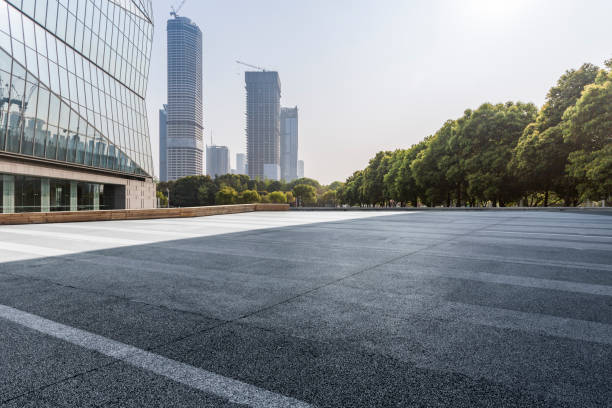 istock Panoramic skyline and modern business office buildings with empty road,empty concrete square floor 971429930