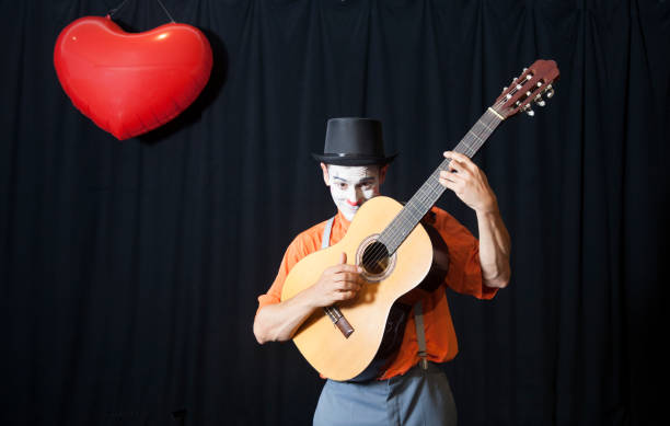 istock Clown playing the guitar 971430920