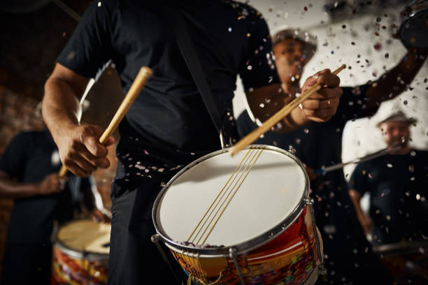 Feeling the rhythm in the drums Closeup shot of a musical performer playing drums with his band drum percussion instrument stock pictures, royalty-free photos & images