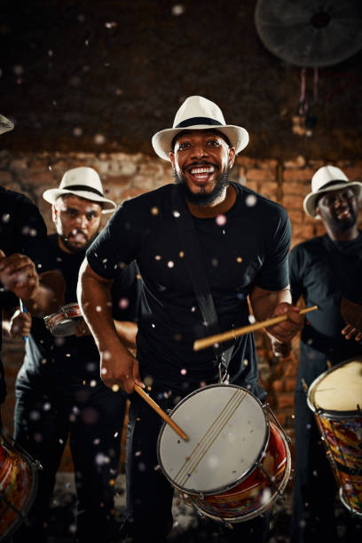 Their beats will keep you dancing all night long Portrait of a group of musical performers playing drums together entertainment occupation stock pictures, royalty-free photos & images