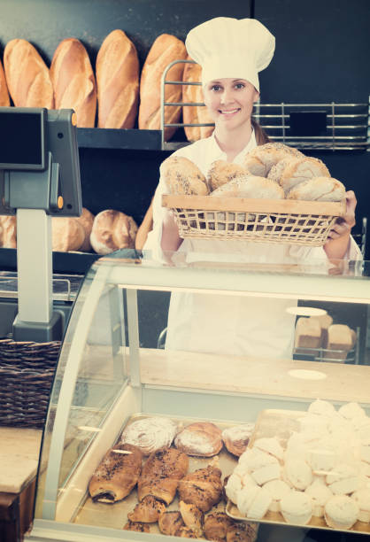 istock Bakery female employee with tasty 971440648