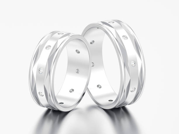 istock 3D illustration two silver gold modern engagement wedding diamond rings 971447518