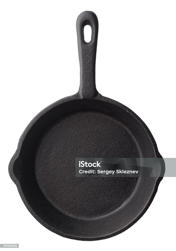 Empty frying pan Isolated objects: empty black cast iron frying pan, isolated on white background Skillet - Cooking Pan Stock Photo