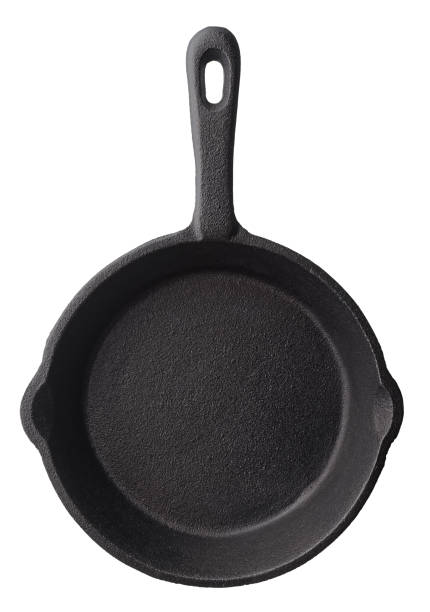 Empty frying pan Isolated objects: empty black cast iron frying pan, isolated on white background skillet cooking pan photos stock pictures, royalty-free photos & images
