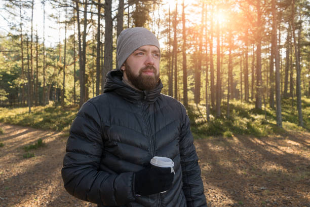 istock Man walking in forest and enjoys weather 971470468