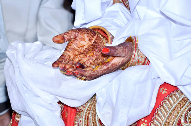 istock Pakistan and Indian bridal showing hands Turmeric paste wedding ceremony 971498136