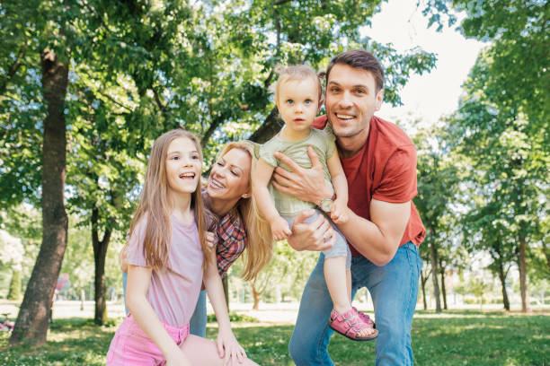 istock Happy young family with two daughters 971498180