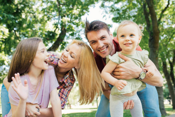 istock Young parents with two happy daughters 971500244