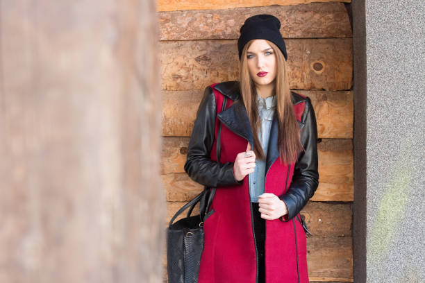 istock Young beautiful brunette in stylish winter coat posing 971503668