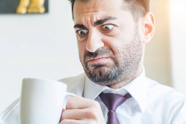 istock Businessman drinking coffee and suprising 971504162