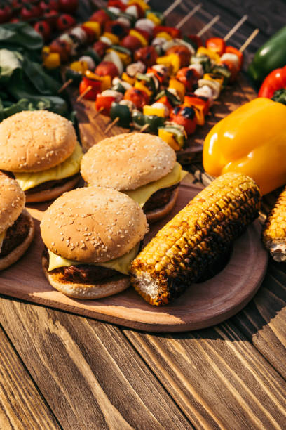 istock Burgers and corn cooked outdoors on grill 971507378