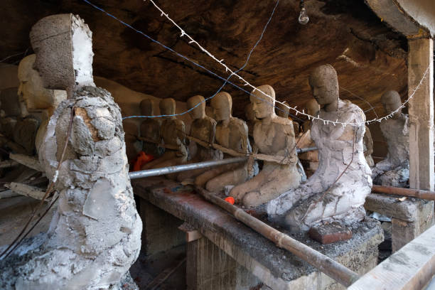 istock Several praying statues on the way to Adams peak. 971513346